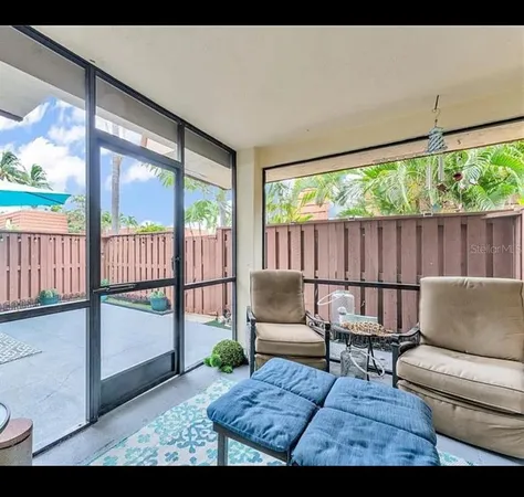 a living room with couch and a large window