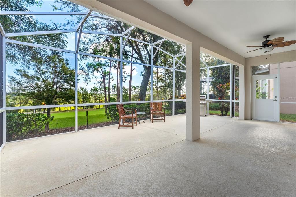 3984 Beacon Ridge Way Clermont, FL 34711 - Photo 35 of 59 Covered Patio with view of 14th hole of Golf Course