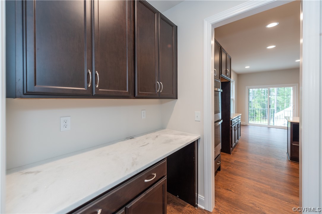 9331 Widthby Road Chesterfield, VA 23832 - Photo 9 of 29 a kitchen with a sink a refrigerator and wooden floor