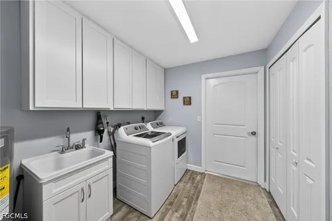 a view of a storage & utility room with a sink