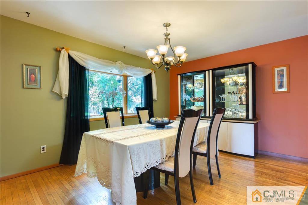 5 Herron Road Edison, NJ 08820 - Photo 12 of 42 a view of a dining room with furniture window and wooden floor