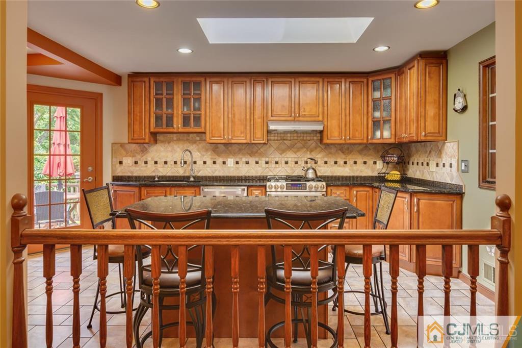 5 Herron Road Edison, NJ 08820 - Photo 13 of 42 a kitchen with a window a sink and cabinets