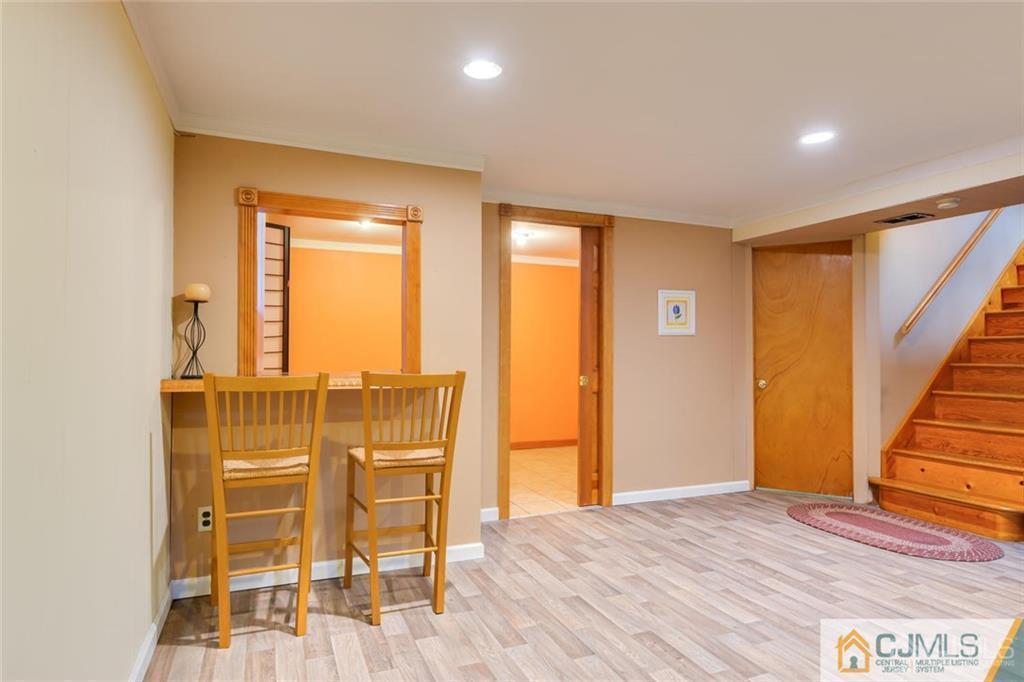 5 Herron Road Edison, NJ 08820 - Photo 28 of 42 a view of an empty room with wooden floor and a window