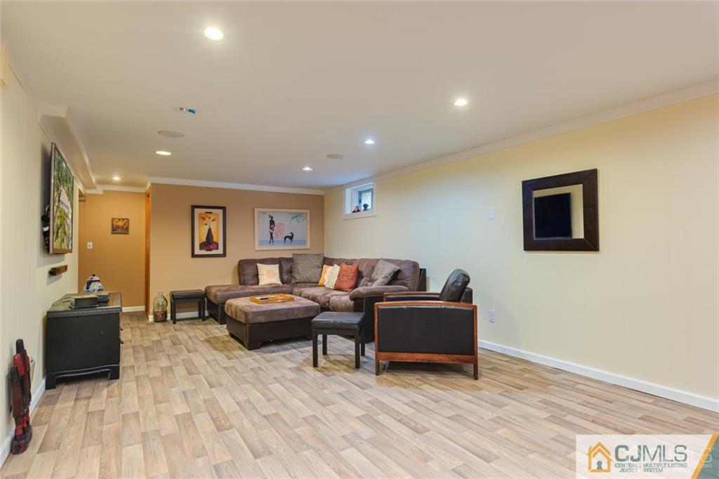 5 Herron Road Edison, NJ 08820 - Photo 29 of 42 a living room with furniture and a wooden floor