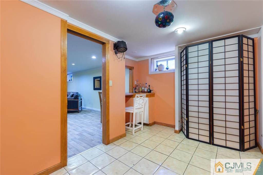 5 Herron Road Edison, NJ 08820 - Photo 31 of 42 a view of a hallway and a livingroom with furniture