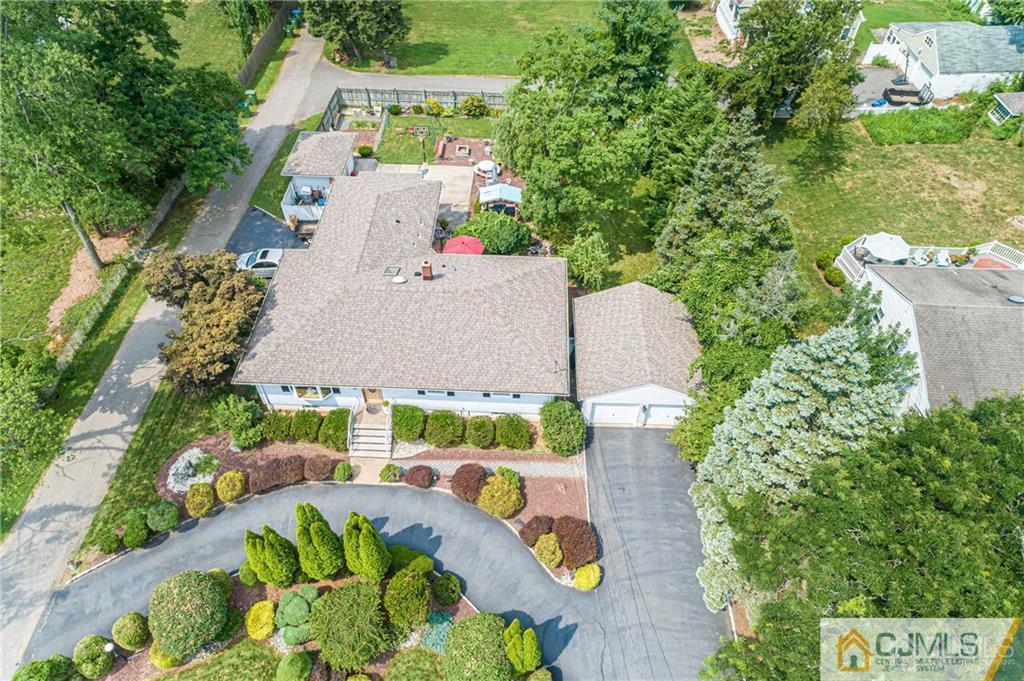 5 Herron Road Edison, NJ 08820 - Photo 4 of 42 an aerial view of house with yard and outdoor seating