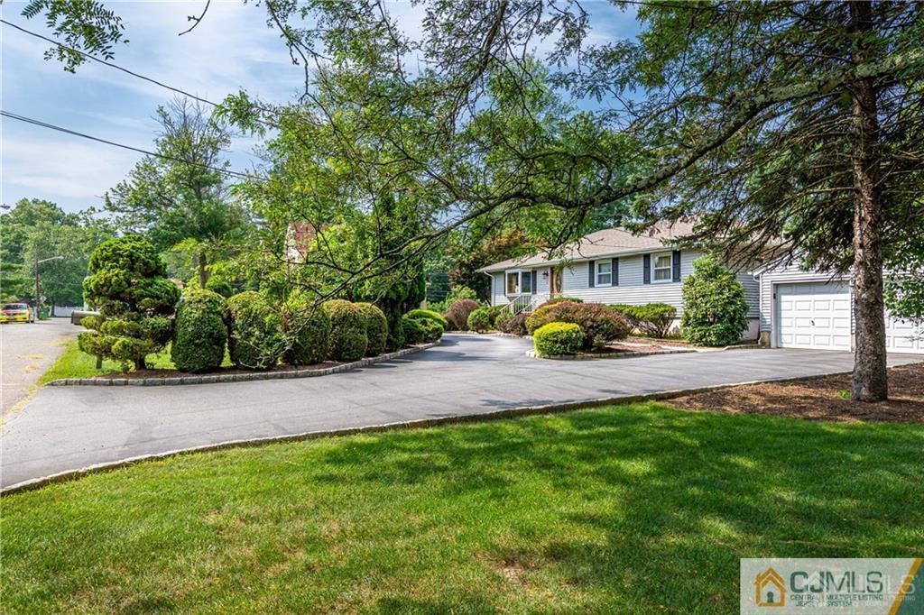 5 Herron Road Edison, NJ 08820 - Photo 5 of 42 a view of a house with a yard and sitting area