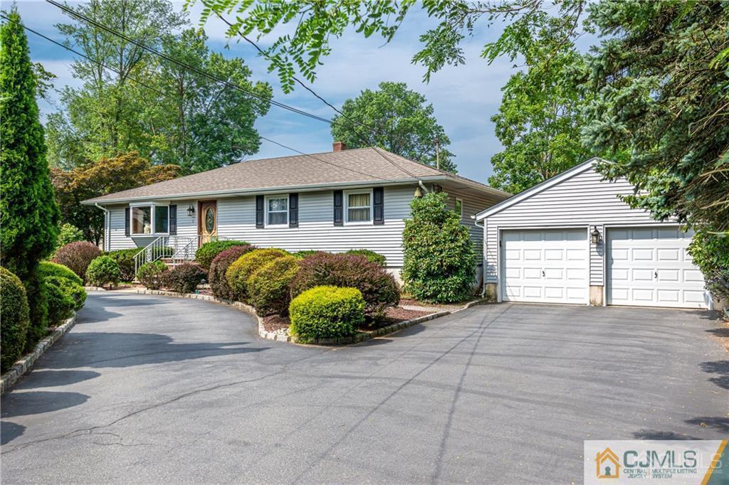 5 Herron Road Edison, NJ 08820 - Photo 6 of 42 a front view of a house with a garden