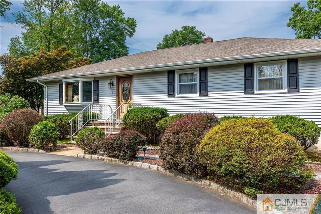 5 Herron Road Edison, NJ 08820 - Photo 7 of 42 a front view of a house with garden