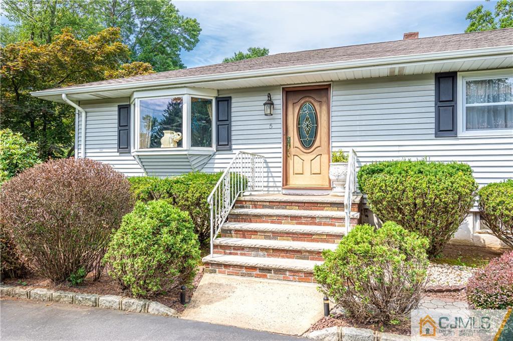 5 Herron Road Edison, NJ 08820 - Photo 9 of 42 a front view of a house with garden