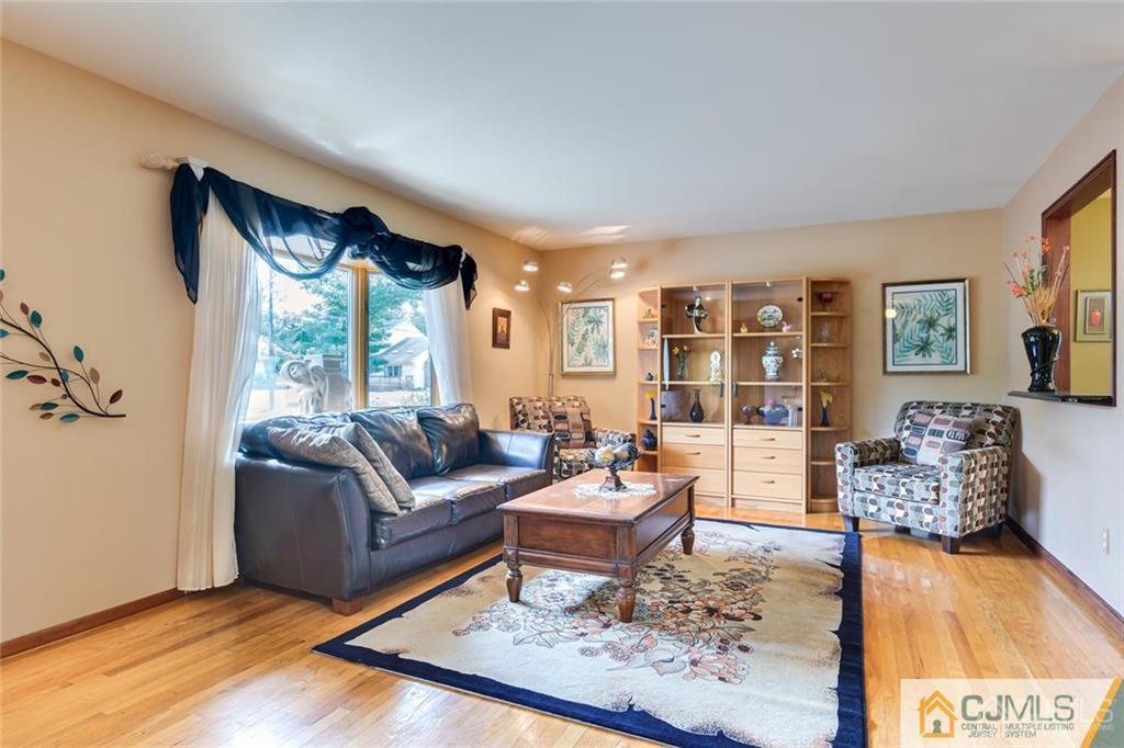 5 Herron Road Edison, NJ 08820 - Photo 10 of 42 a living room with furniture and a large window
