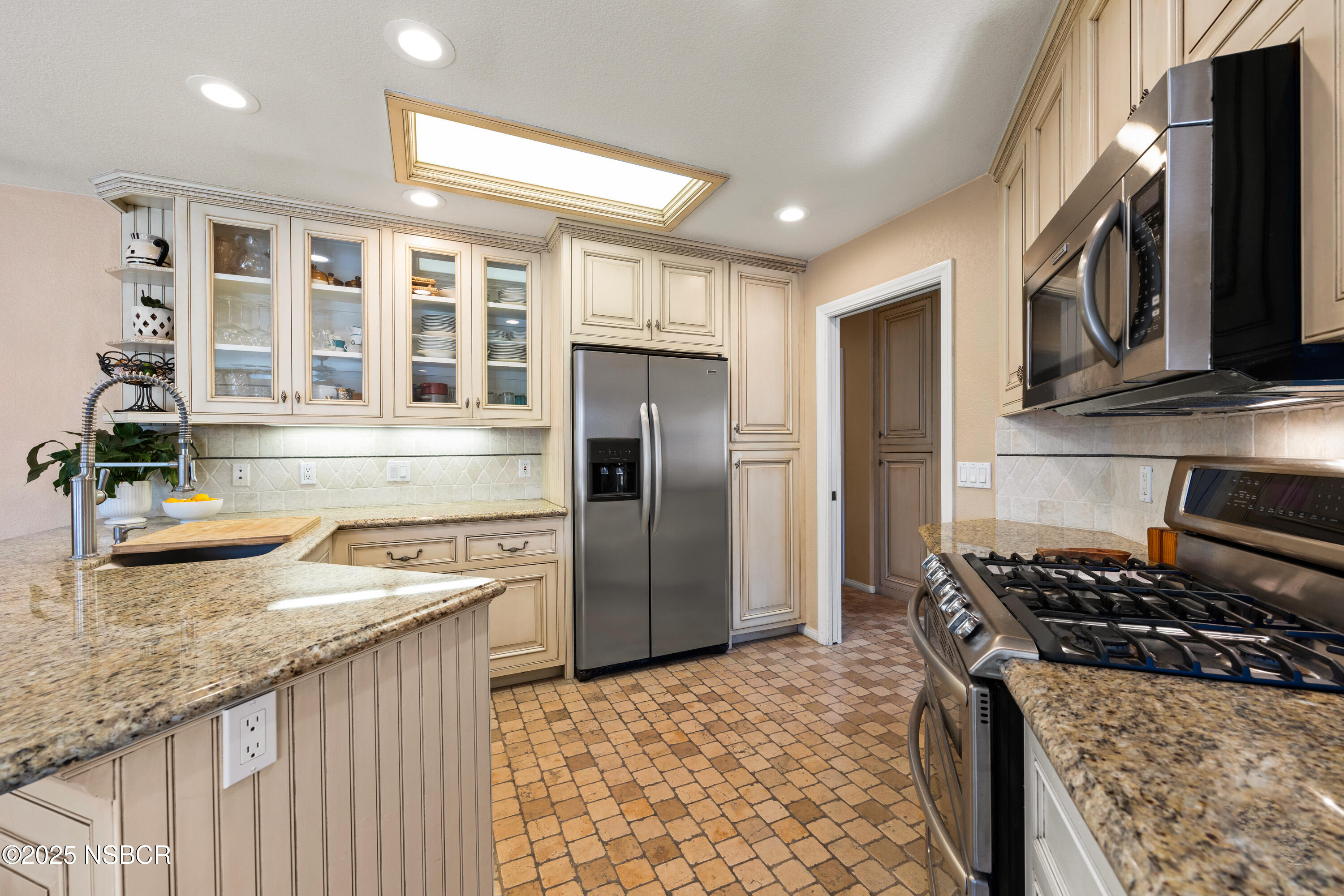922 College Canyon Road Solvang, CA 93463 - Photo 6 of 23 a kitchen with a stove a sink and a refrigerator