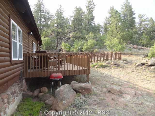 87 Apache Road Florissant, CO 80816 - Photo 14 of 16 Back deck and yard