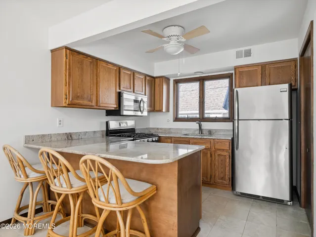 a kitchen with a sink cabinets and window