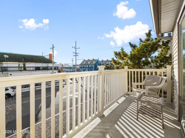 a bedroom with two beds and a window