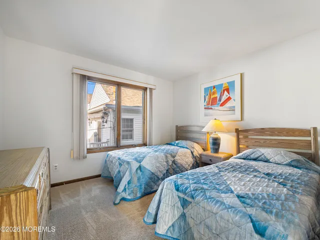 a bed room with a bed and a window