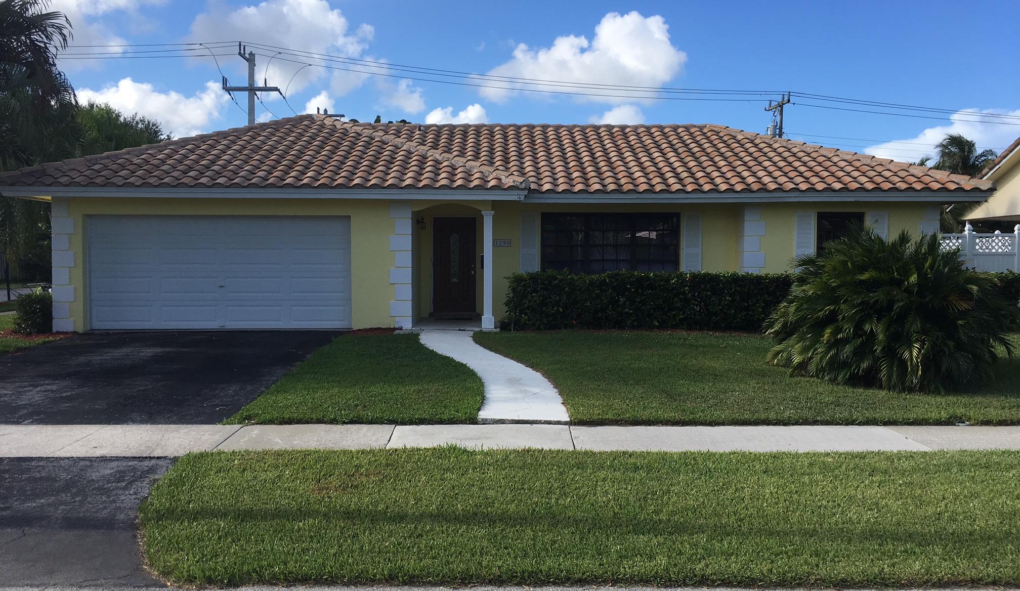 1299 Southwest 4th Street Boca Raton, FL 33486 - Photo 1 of 34 a front view of a house