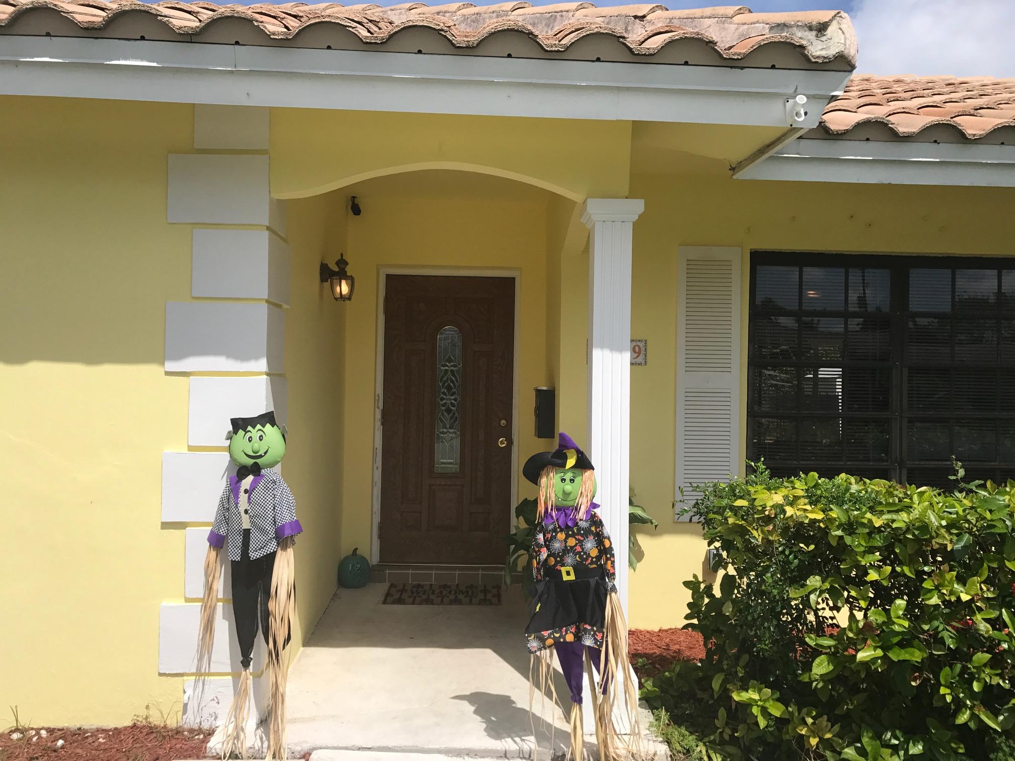 1299 Southwest 4th Street Boca Raton, FL 33486 - Photo 3 of 34 a front view of a house with a yard