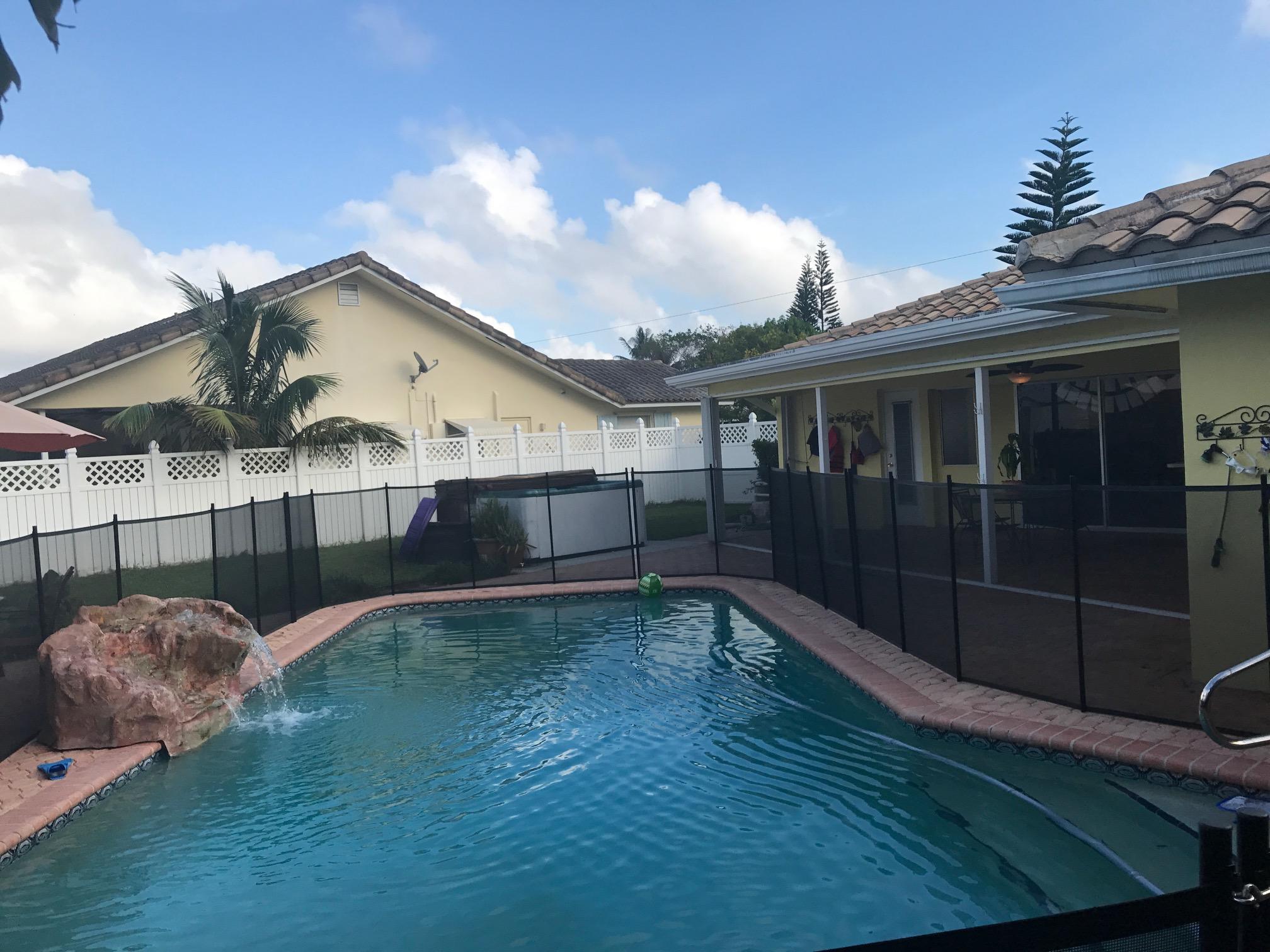 1299 Southwest 4th Street Boca Raton, FL 33486 - Photo 6 of 34 a front view of a house with garden