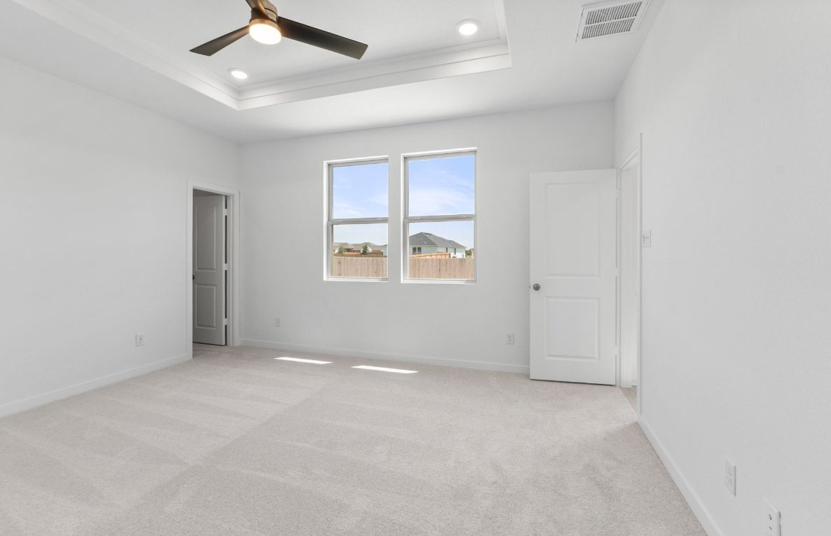 1016 Kerr Court Temple, TX 76501 - Photo 7 of 15 an empty room with windows and ceiling fan