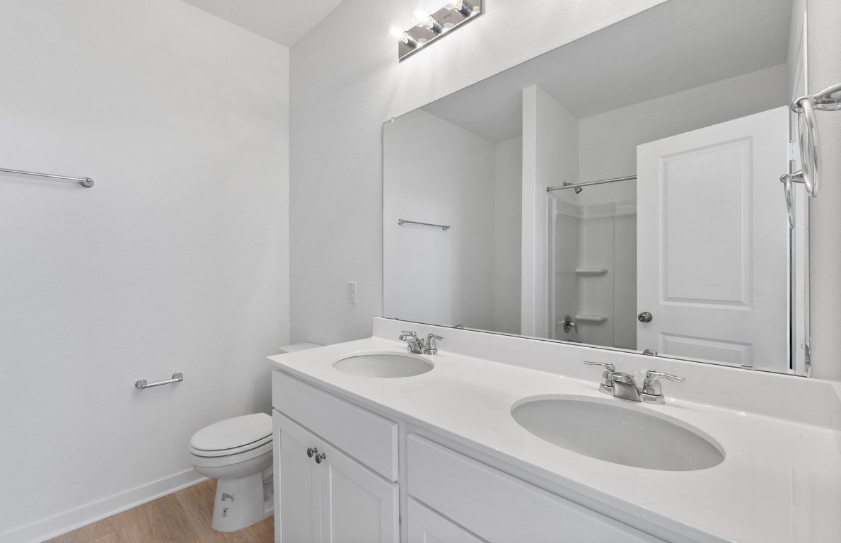 1016 Kerr Court Temple, TX 76501 - Photo 9 of 15 a bathroom with a toilet sink and mirror