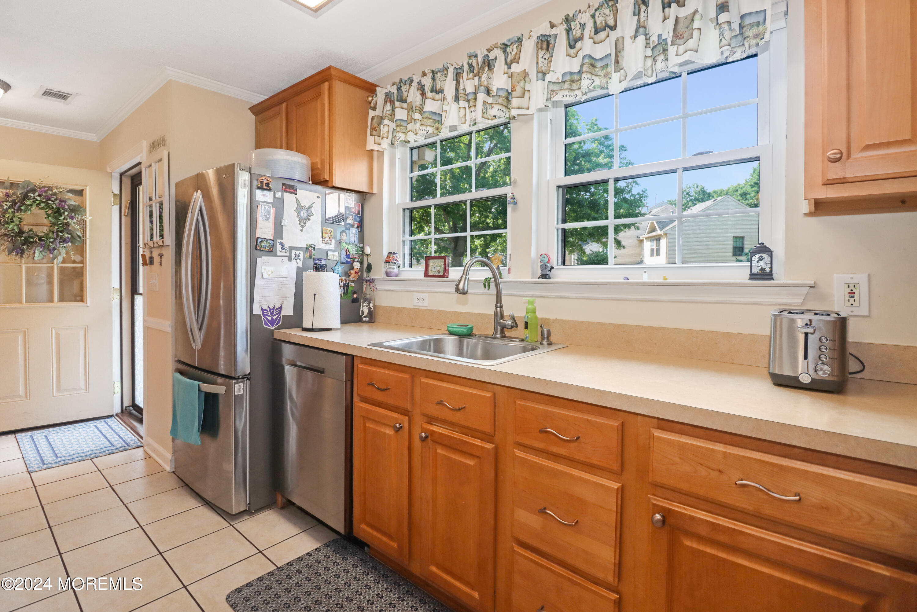 100 Whispering Oaks Way Jackson, NJ 08527 - Photo 17 of 56 a kitchen with stainless steel appliances a sink and a window