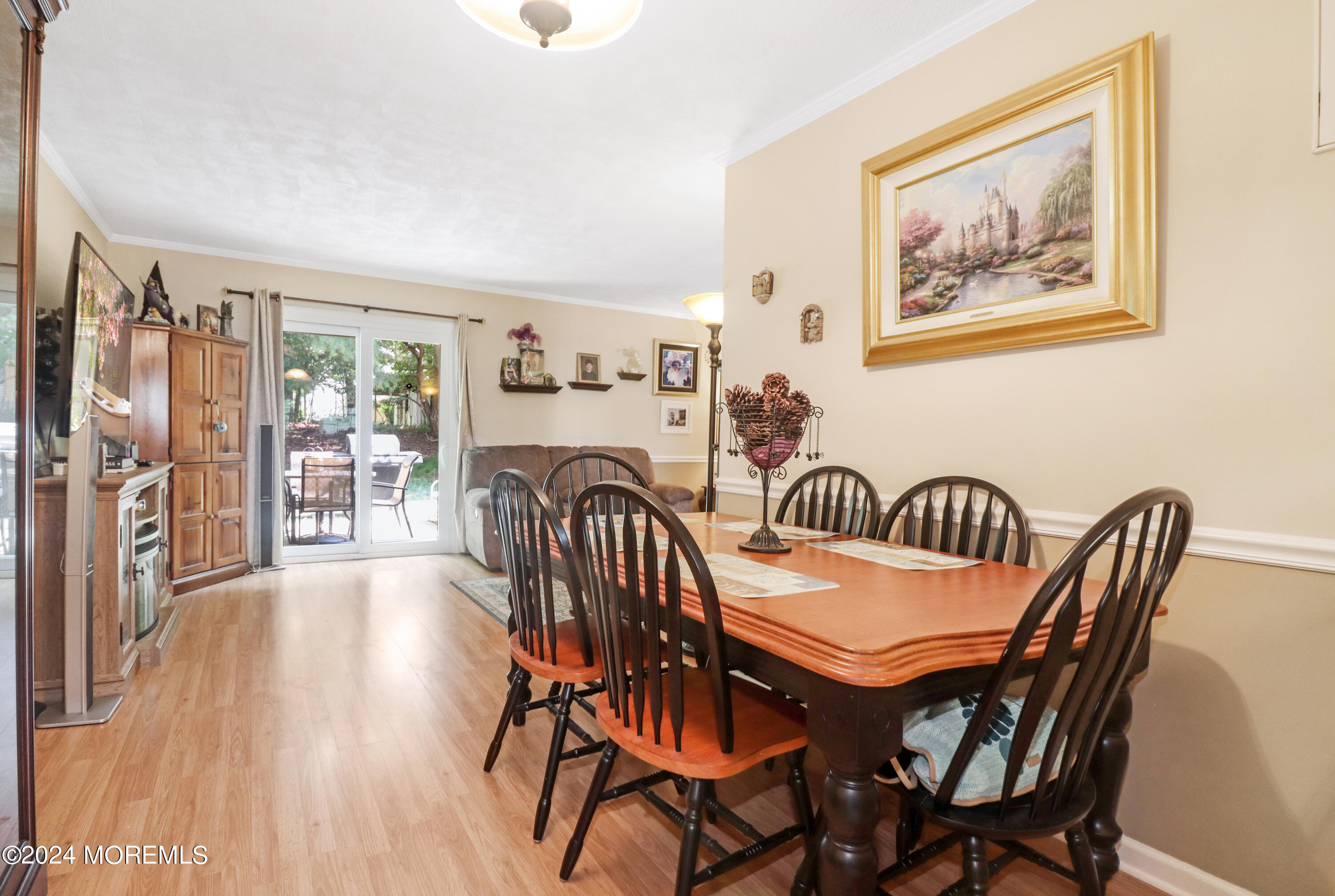 100 Whispering Oaks Way Jackson, NJ 08527 - Photo 20 of 56 a view of a dining room with furniture window and wooden floor