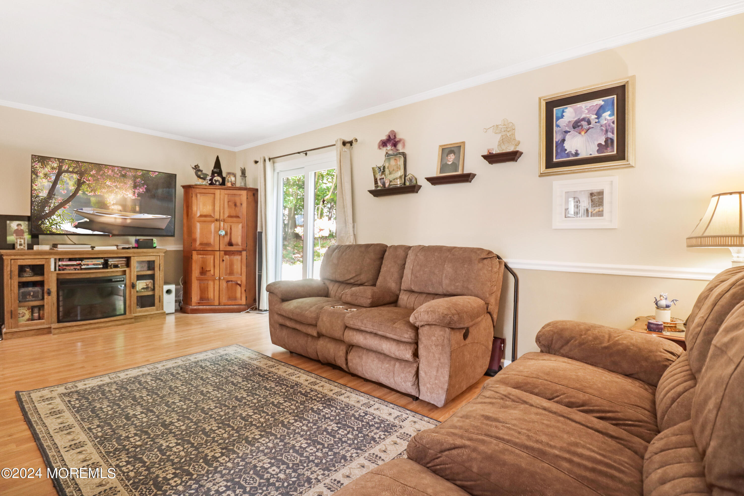 100 Whispering Oaks Way Jackson, NJ 08527 - Photo 25 of 56 a living room with furniture and a rug