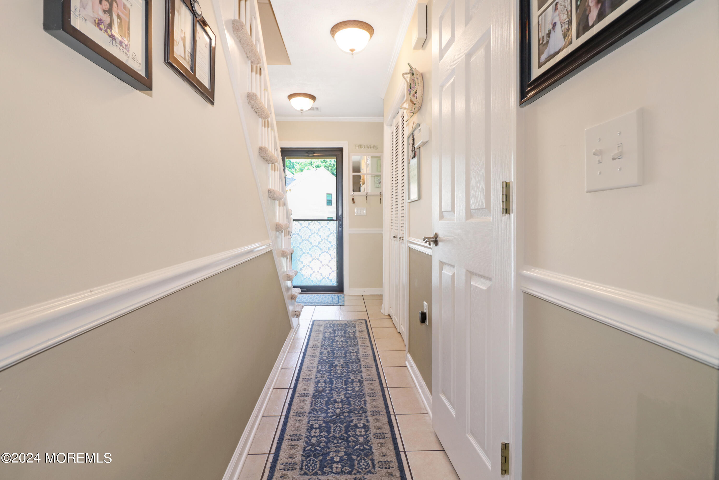 100 Whispering Oaks Way Jackson, NJ 08527 - Photo 26 of 56 a view of a hallway with wooden floor and staircase