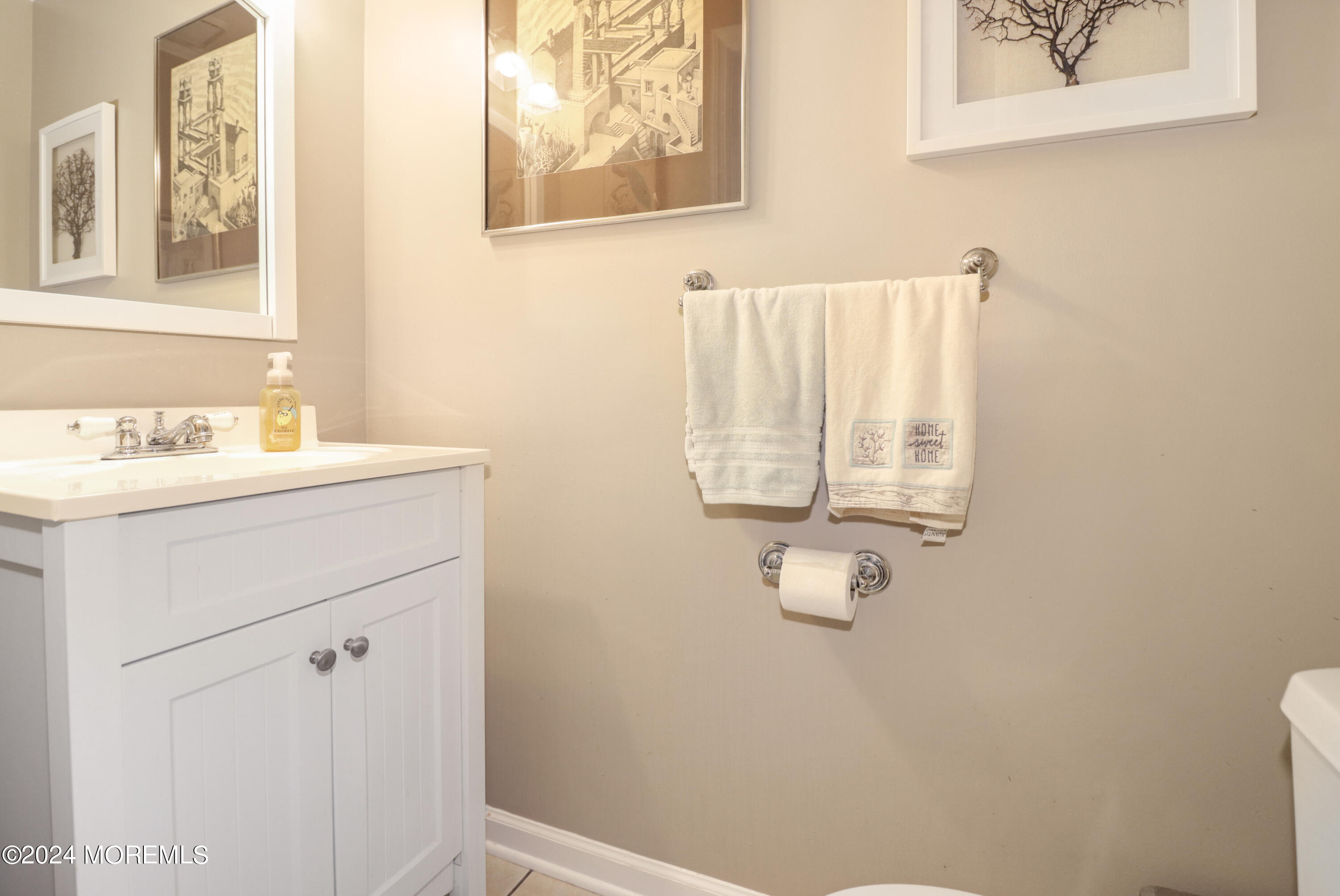 100 Whispering Oaks Way Jackson, NJ 08527 - Photo 27 of 56 a bathroom with a sink and a mirror