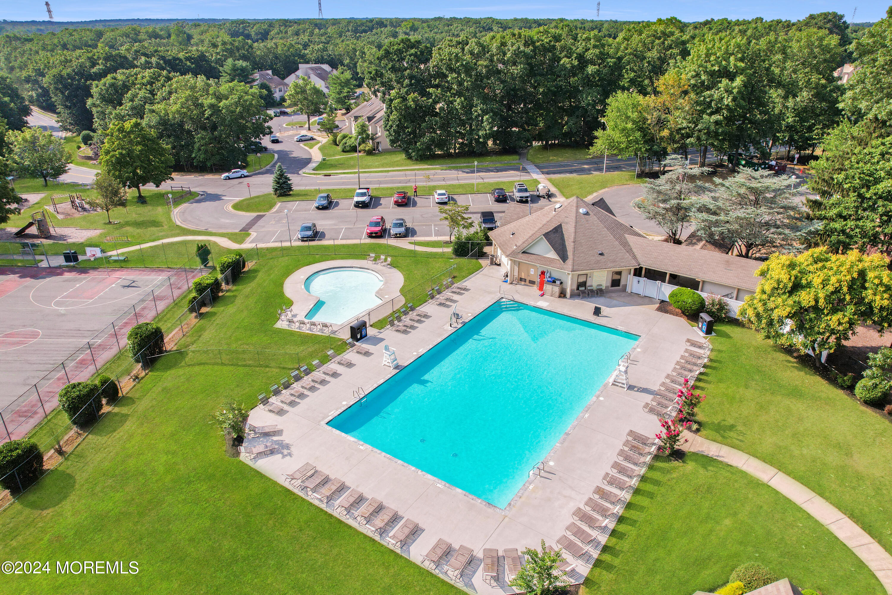 100 Whispering Oaks Way Jackson, NJ 08527 - Photo 38 of 56 an aerial view of a tennis ground and a garden
