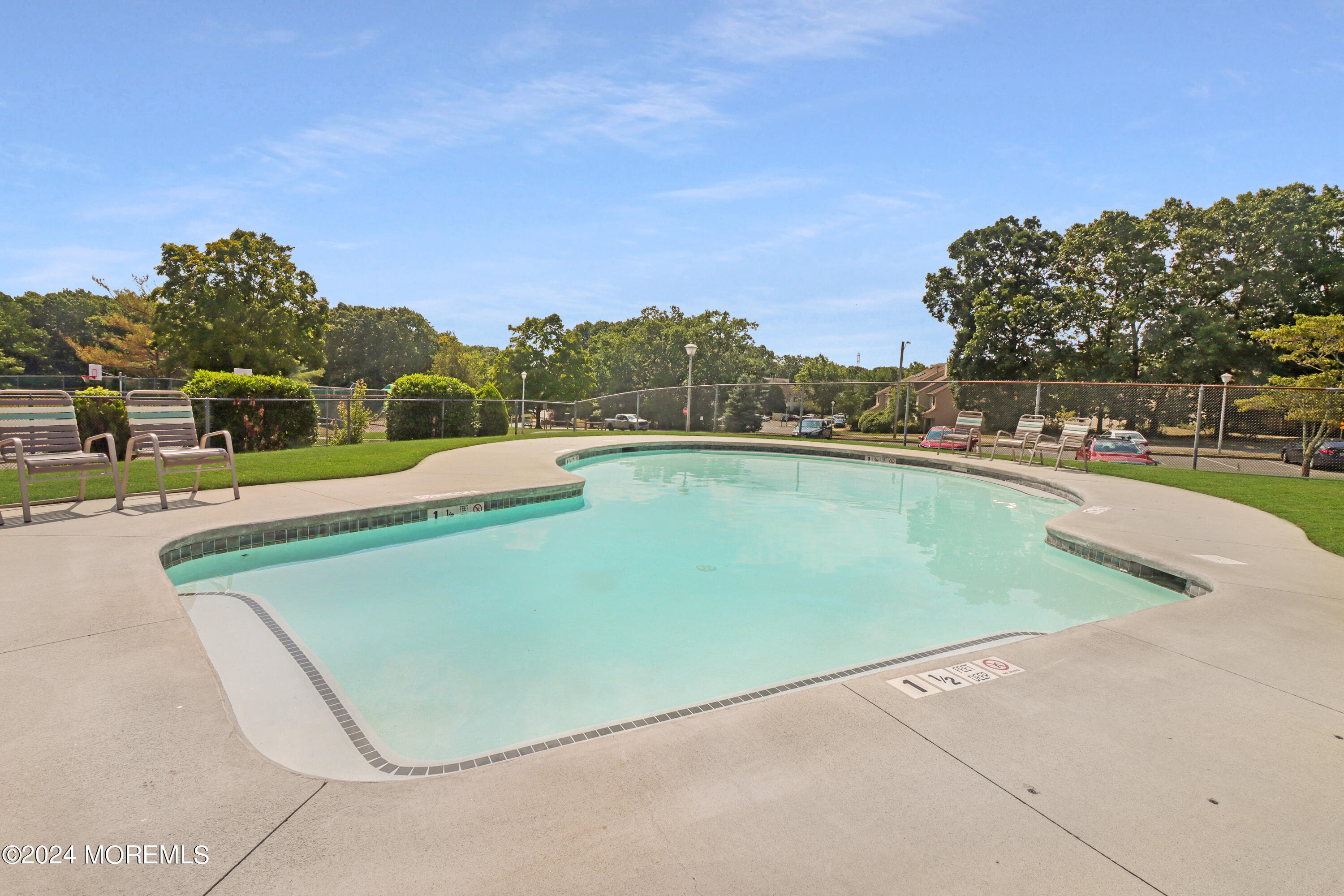 100 Whispering Oaks Way Jackson, NJ 08527 - Photo 42 of 56 a view of a swimming pool with an outdoor seating and a mountain view