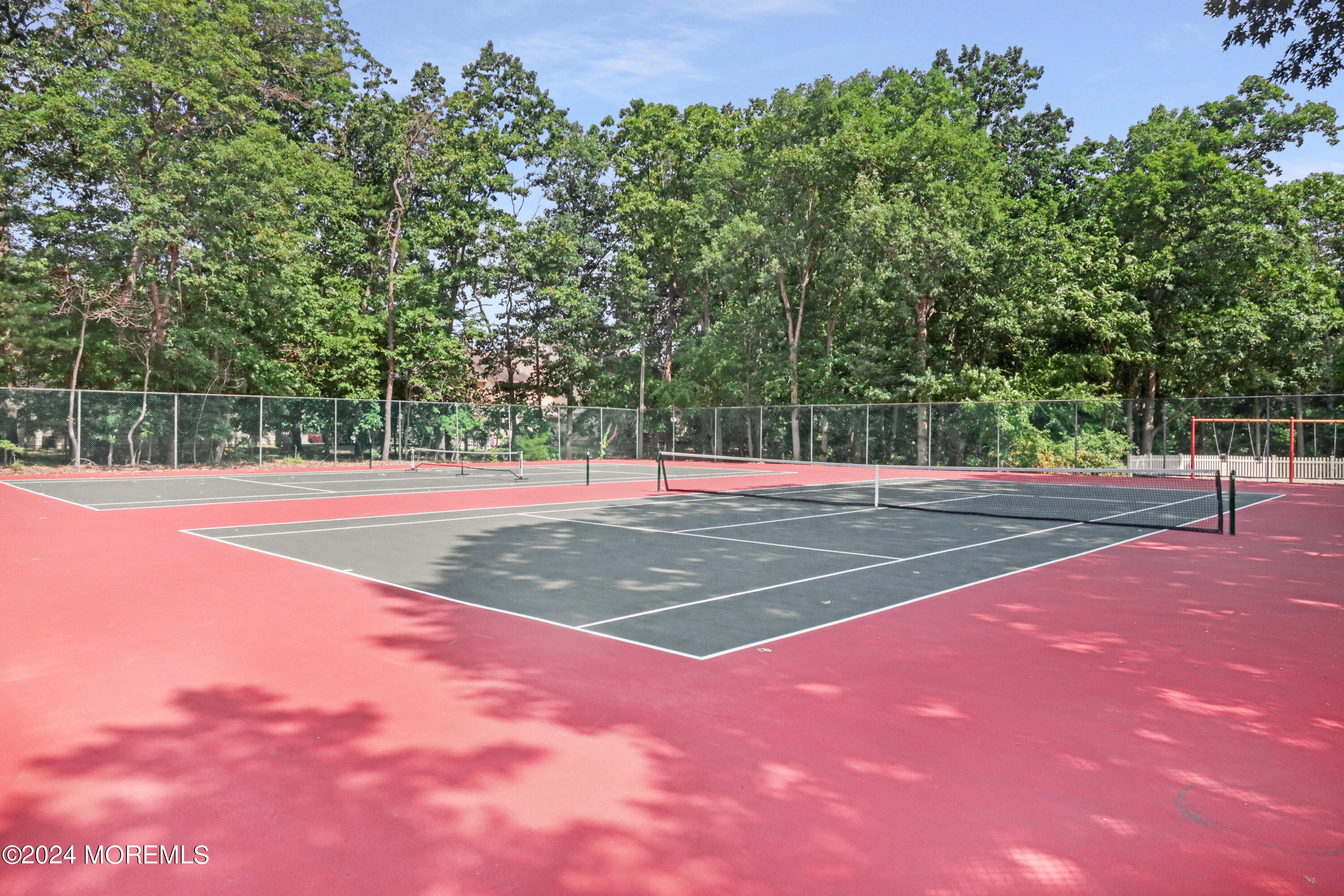 100 Whispering Oaks Way Jackson, NJ 08527 - Photo 45 of 56 a view of a tennis court