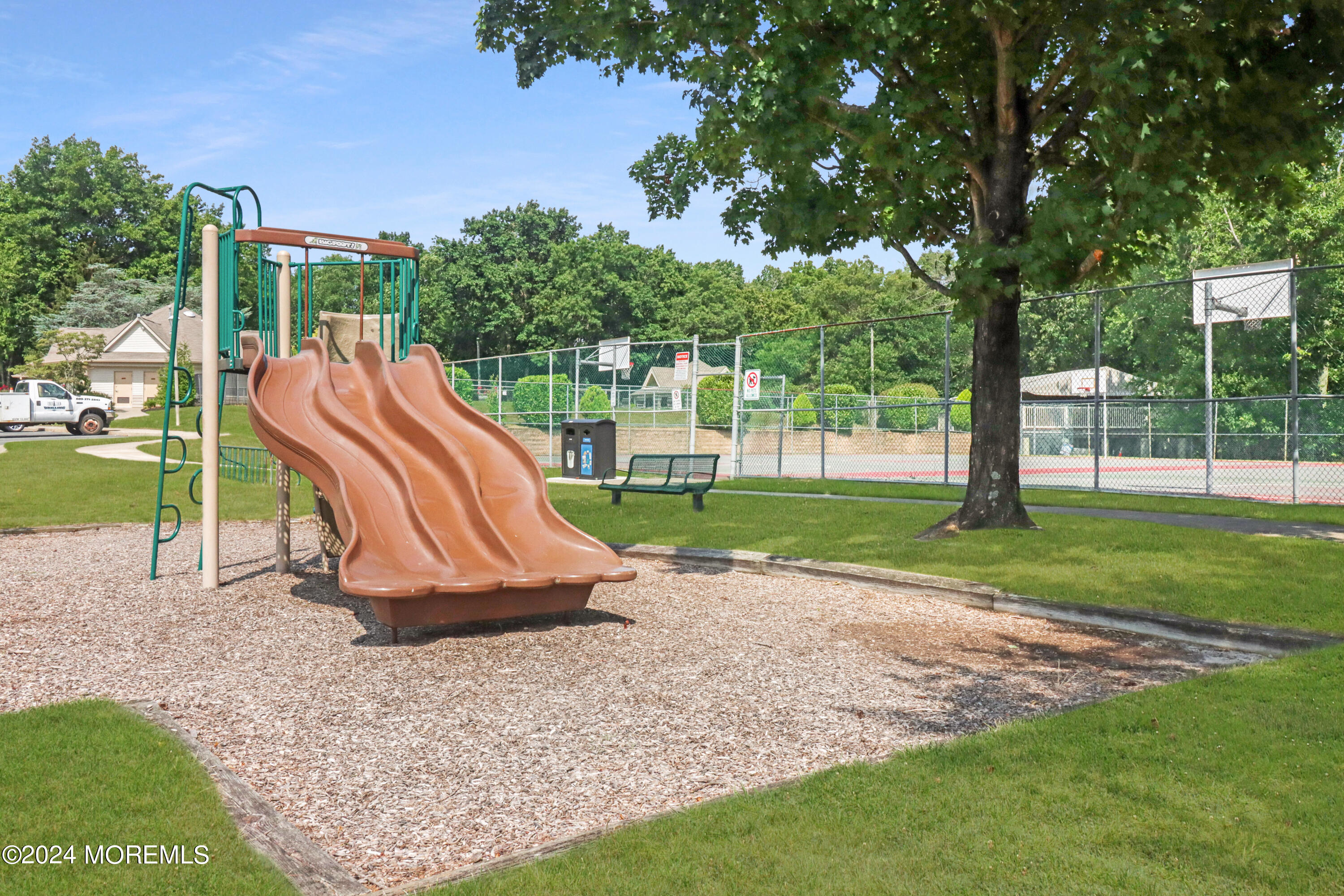 100 Whispering Oaks Way Jackson, NJ 08527 - Photo 48 of 56 a view of outdoor space with playground and green space