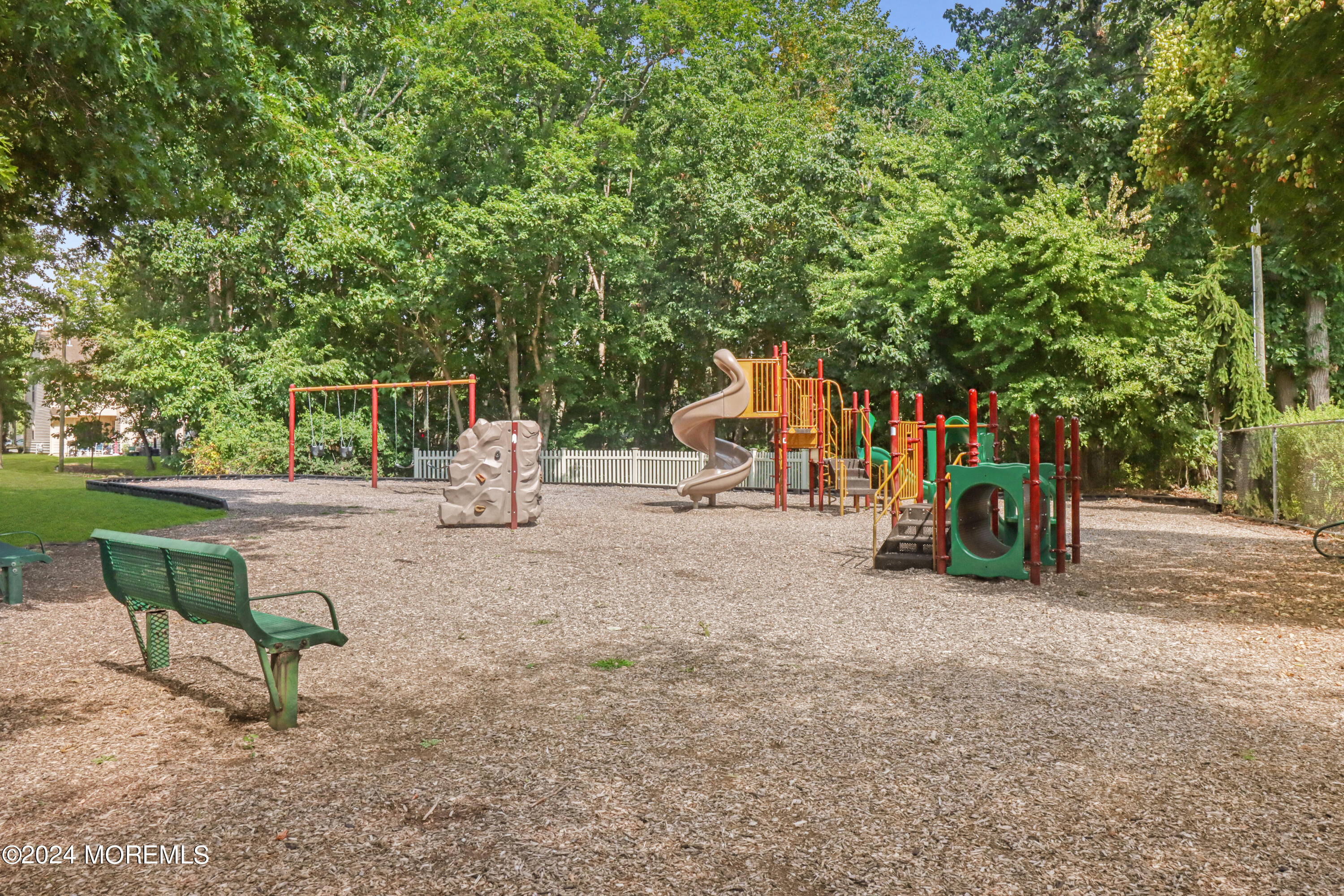 100 Whispering Oaks Way Jackson, NJ 08527 - Photo 50 of 56 a childrens park with lots of swings and slides