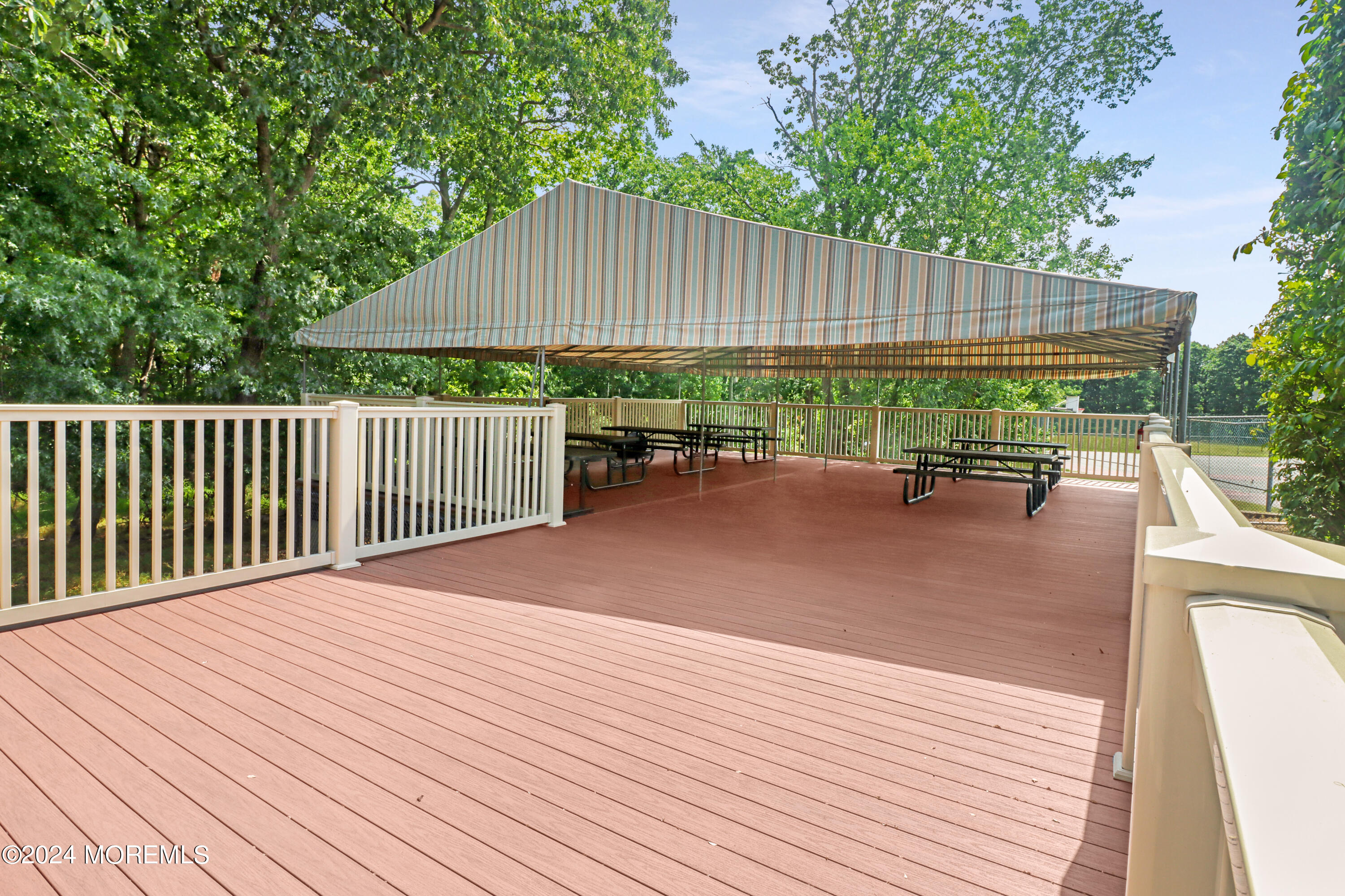 100 Whispering Oaks Way Jackson, NJ 08527 - Photo 52 of 56 a backyard of a house with wooden floor yard and outdoor seating