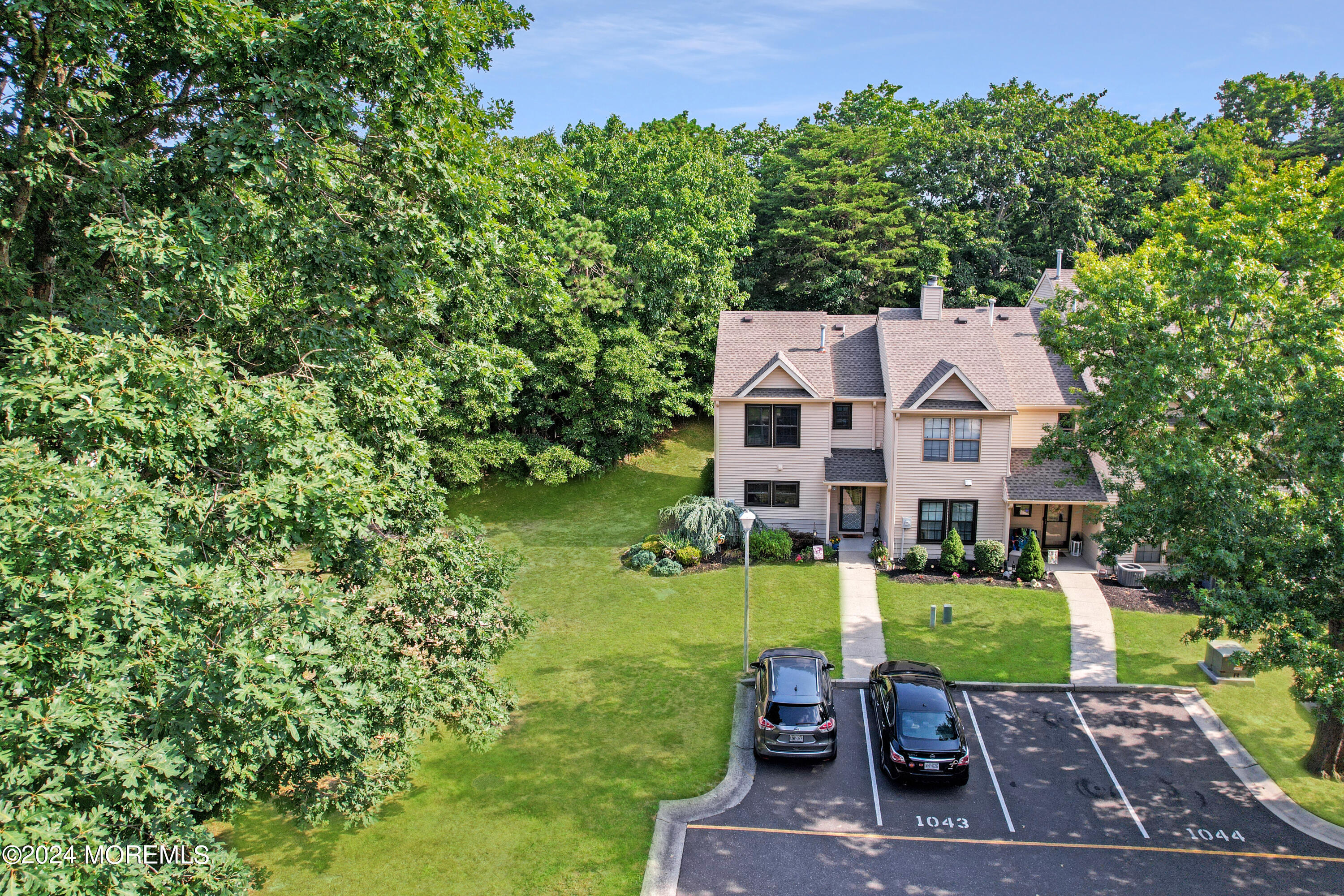 100 Whispering Oaks Way Jackson, NJ 08527 - Photo 8 of 56 a view of a big yard with plants and large trees