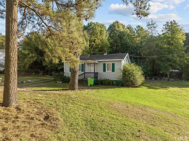 a house view with a backyard space