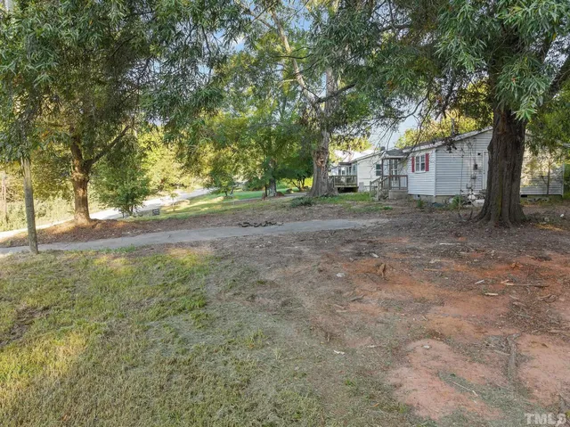 a view of a yard with a large trees