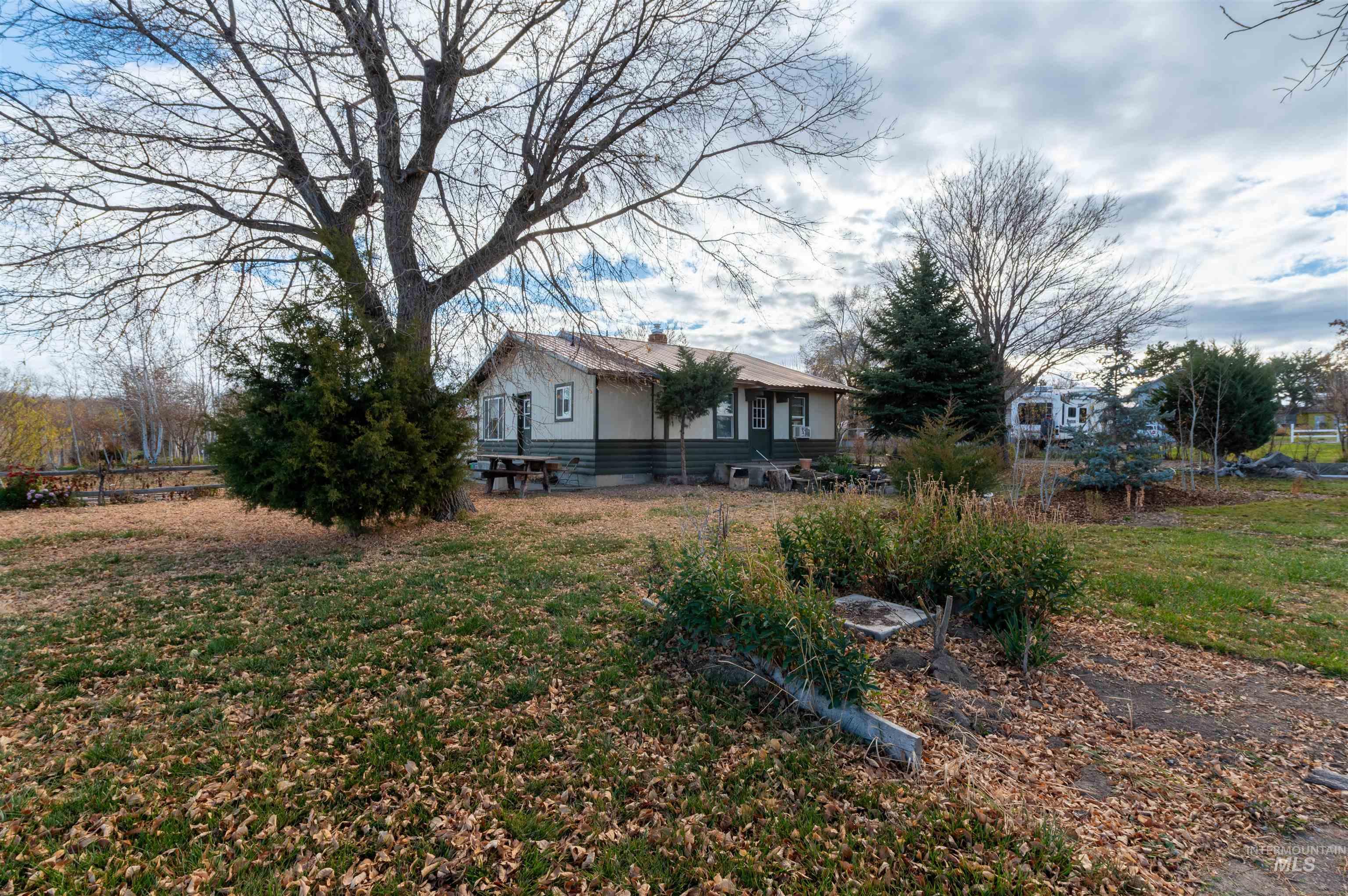 408 Clear Lakes Road Buhl, ID 83316 - Photo 7 of 16 Back of property with a lawn