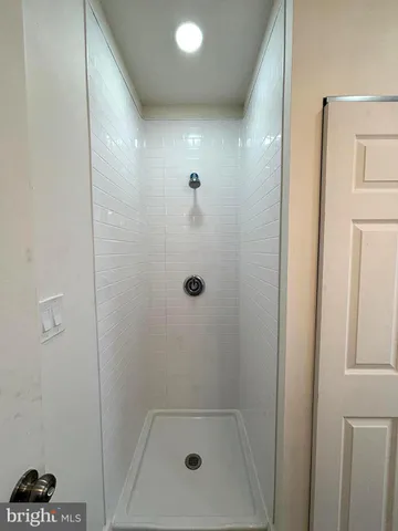 a bathroom with a toilet a sink and a mirror