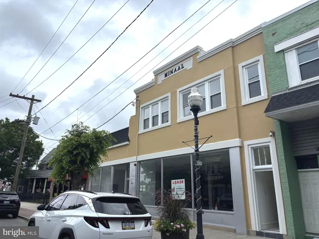 a front view of a building with parking space