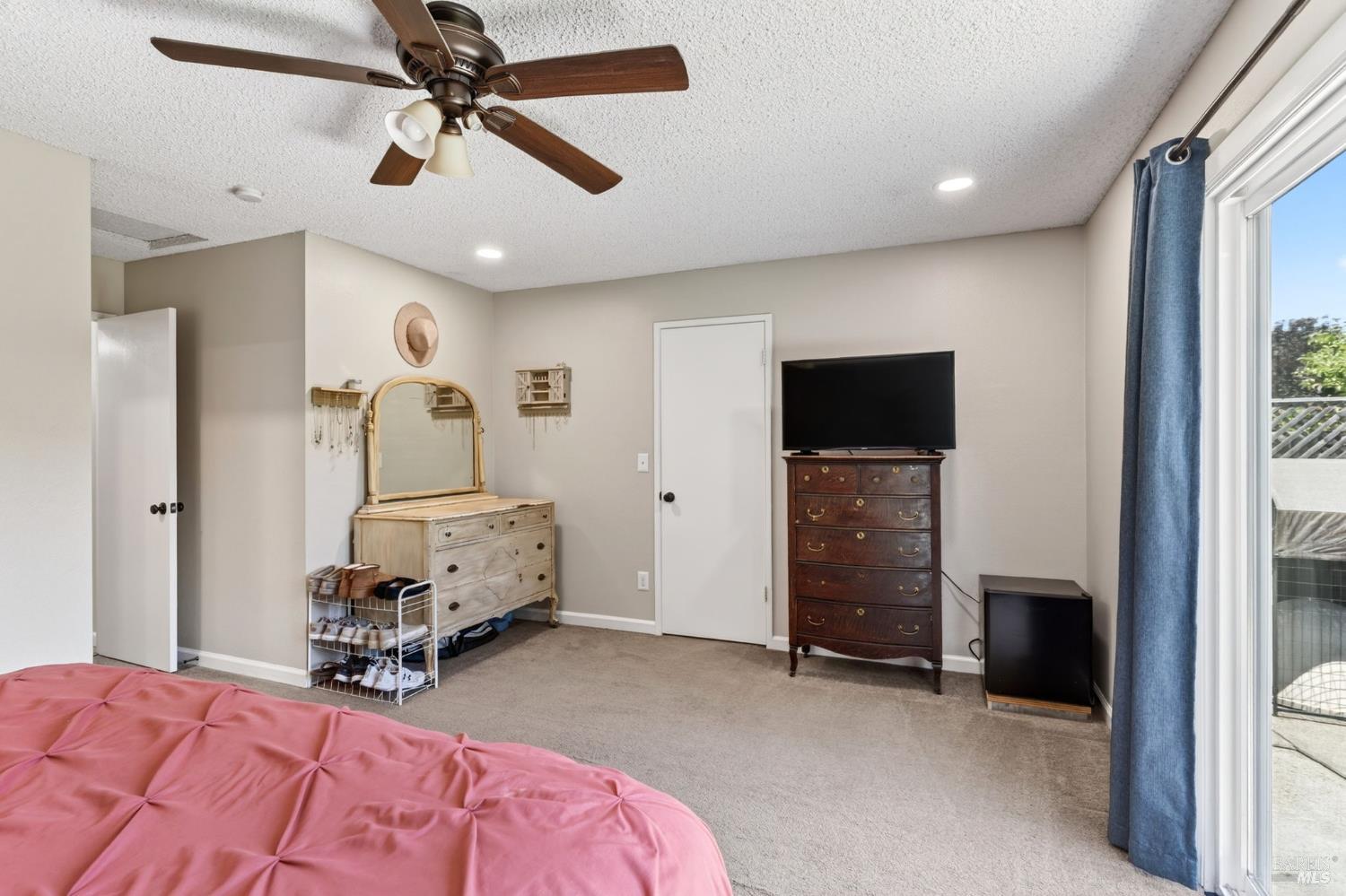 4526 Hillview Court Rohnert Park, CA 94928 - Photo 15 of 28 a bedroom with furniture and a flat screen tv