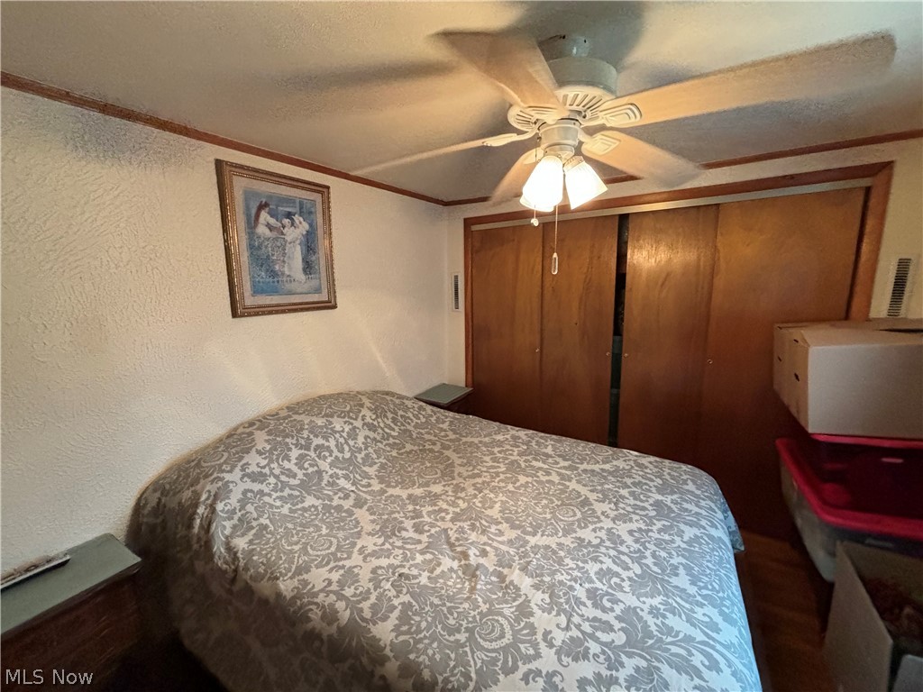 2417 Mc Adoo Ridge Road Wellsburg, WV 26070 - Photo 11 of 33 Bedroom with a closet and ceiling fan