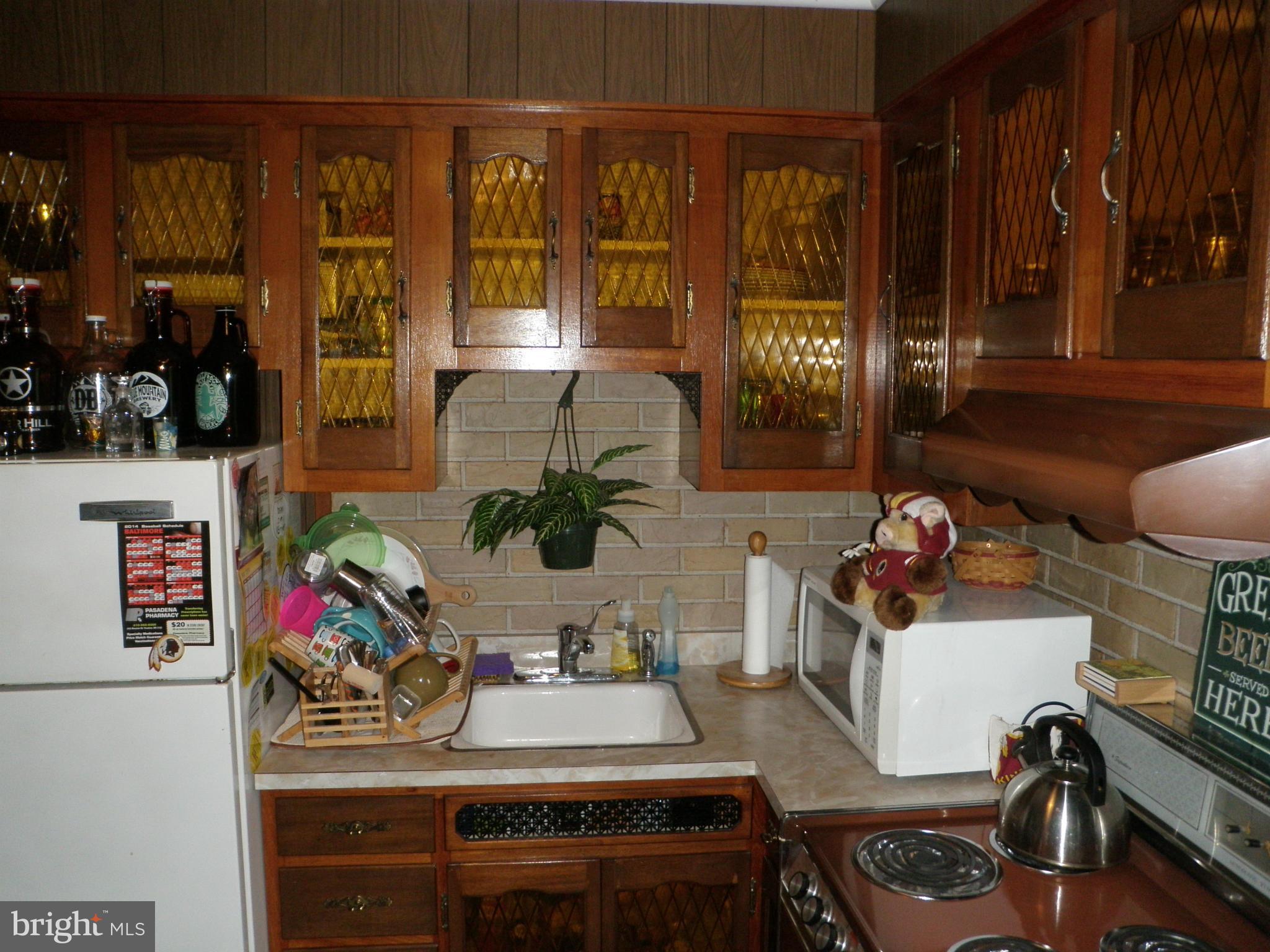 126 Cecil Road Pasadena, MD 21122 - Photo 28 of 30 Kitchen w/ back door to yard (second house)