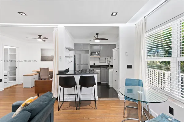 a kitchen with a stove and a refrigerator