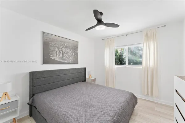 a view of room with hardwood floor and window