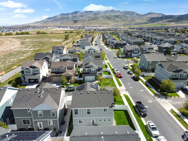 5155 East Rio Grande Way Eagle Mountain, UT 84005 - Photo 38 of 40 Aerial perspective of suburban area featuring a mountain backdrop