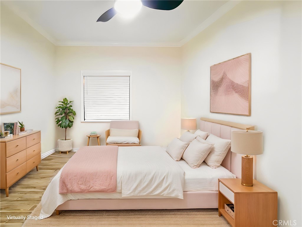 12530 Royal Road, Unit 46 El Cajon, CA 92021 - Photo 11 of 17 a bedroom with a large bed and a potted plant