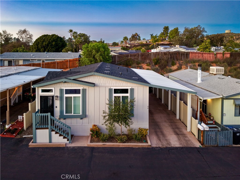 12530 Royal Road, Unit 46 El Cajon, CA 92021 - Photo 15 of 17 a front view of a house with a yard